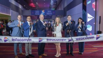 Third from left, David Labuskes, CEO of AVIXA, and InfoComm management cut the ribbon to open the festivities last week. Photo: John Staley.