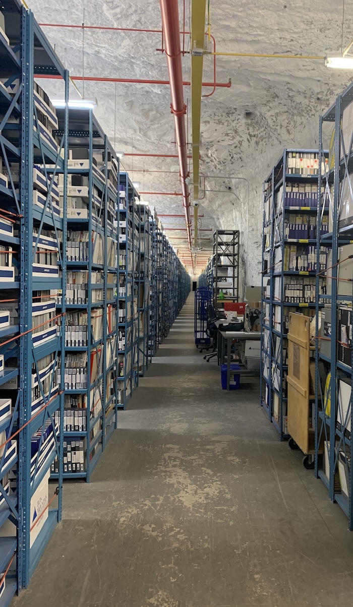 Shelves of media assets stretch as far as the eye can see at Iron Mountain’s secure, climate-controlled, underground facility in Boyers, Penn. Photo: Courtesy of Iron Mountain.