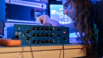 Softube’s Kim Larsson preparing to test components in a Tube-Tech SMC2B Stereo Compressor during a modeling project.